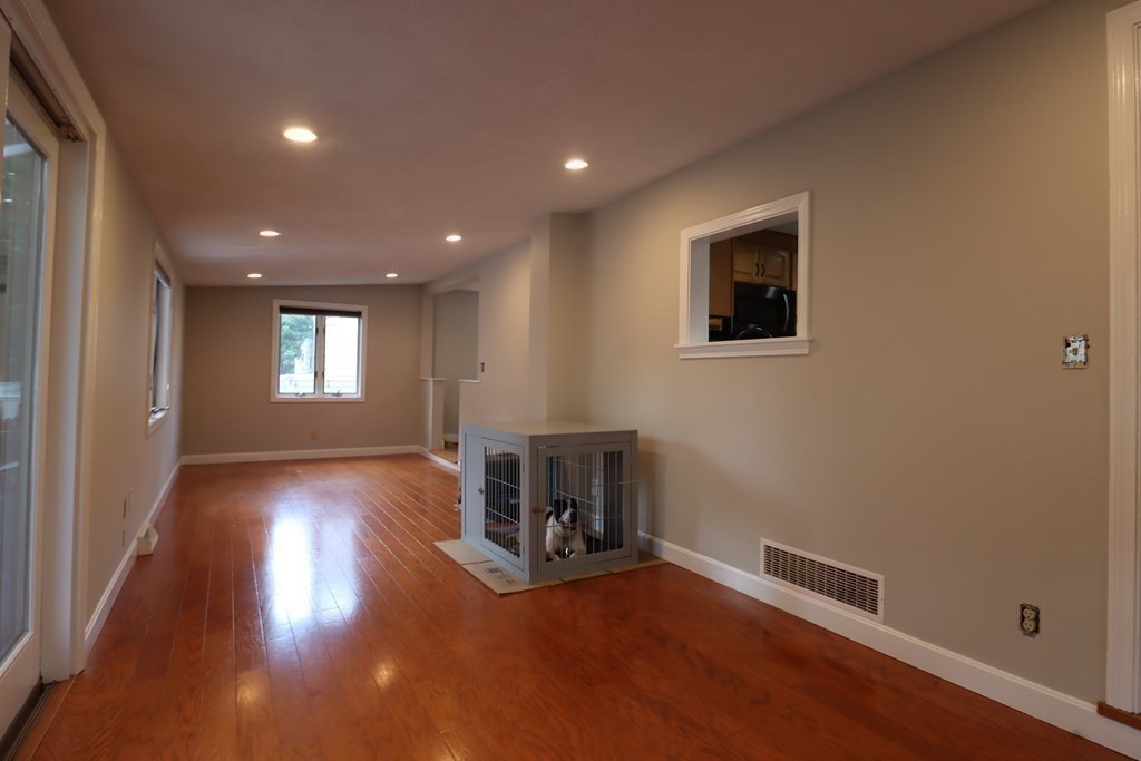 31 Longview Way Peabody, MA 01960 - Photo 15 of 42 a view of livingroom with hardwood floor and a fireplace