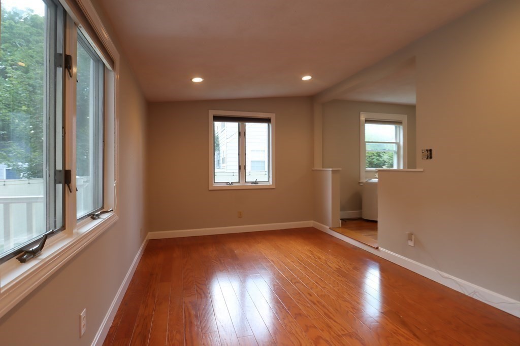 31 Longview Way Peabody, MA 01960 - Photo 16 of 42 an empty room with wooden floor and windows