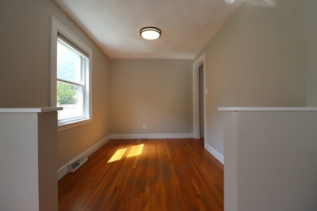 31 Longview Way Peabody, MA 01960 - Photo 17 of 42 a view of empty room with wooden floor and fan