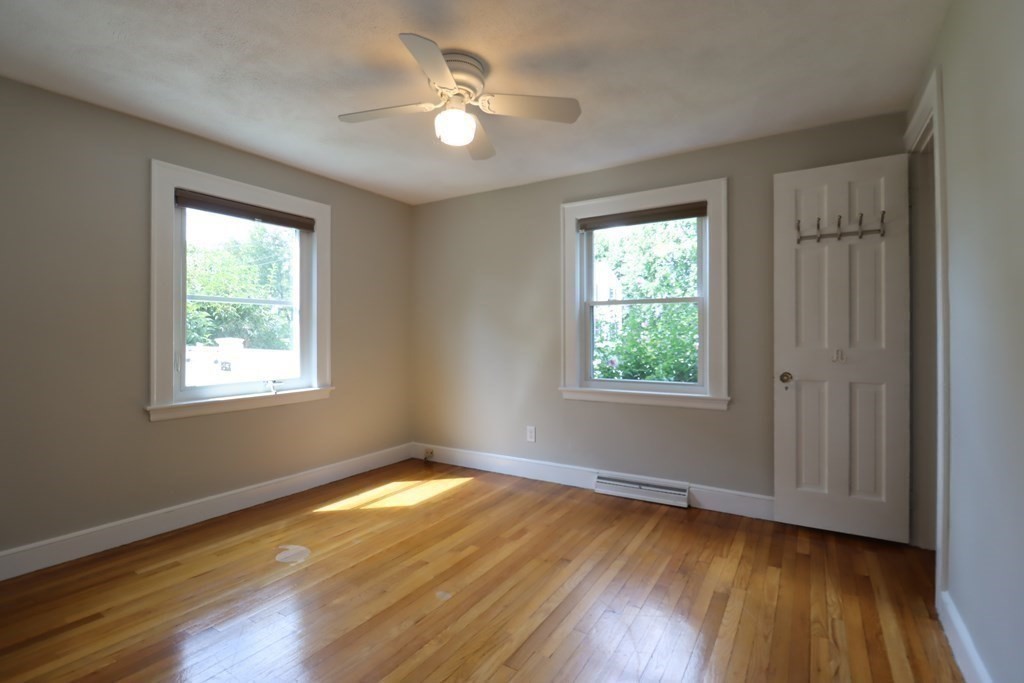 31 Longview Way Peabody, MA 01960 - Photo 18 of 42 a view of empty room with wooden floor and fan