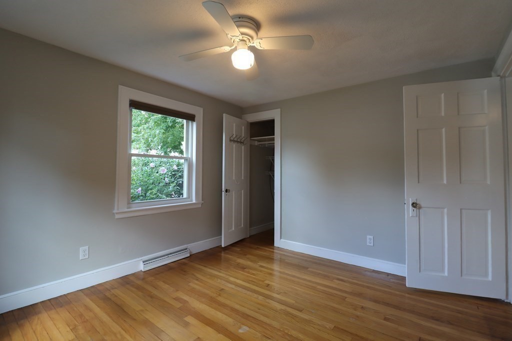 31 Longview Way Peabody, MA 01960 - Photo 19 of 42 a view of empty room with wooden floor and fan