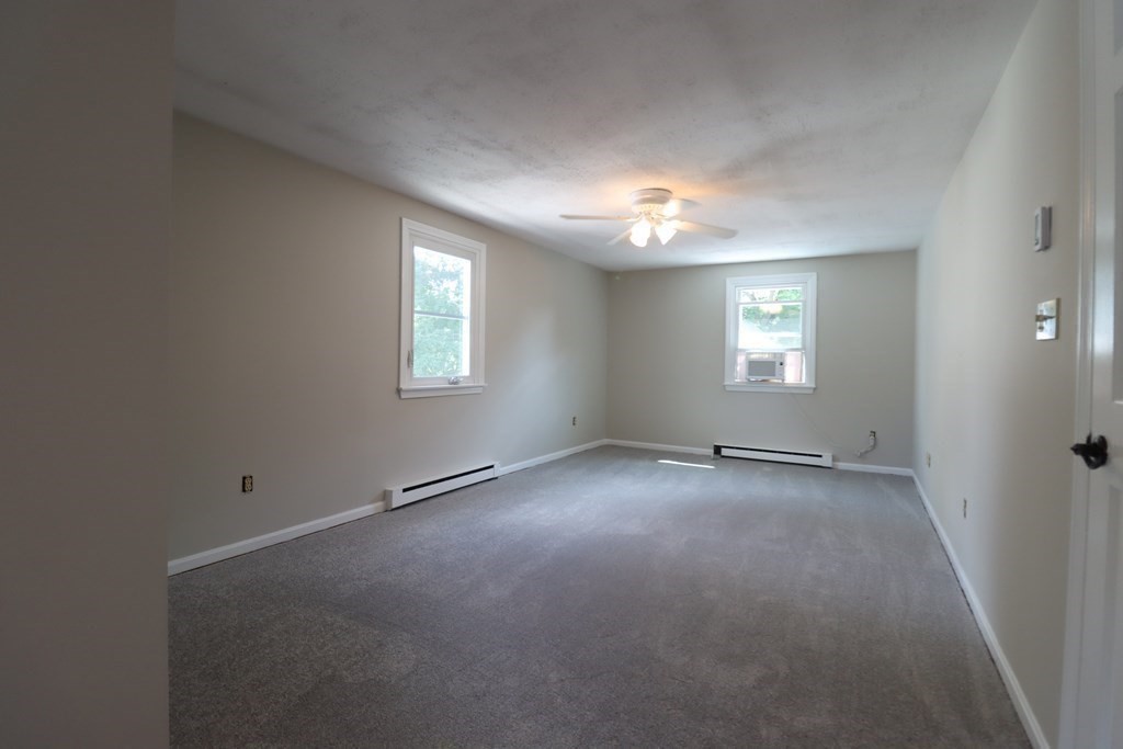 31 Longview Way Peabody, MA 01960 - Photo 20 of 42 an empty room with windows and closet