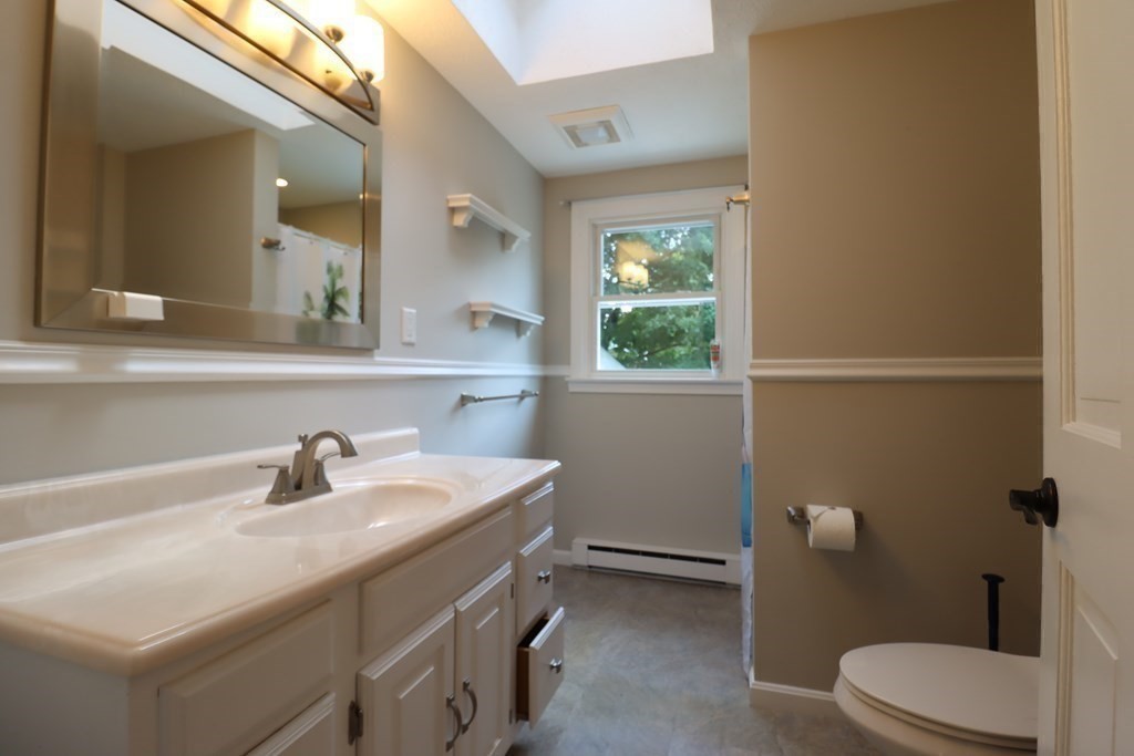 31 Longview Way Peabody, MA 01960 - Photo 24 of 42 a bathroom with a sink a toilet and a mirror