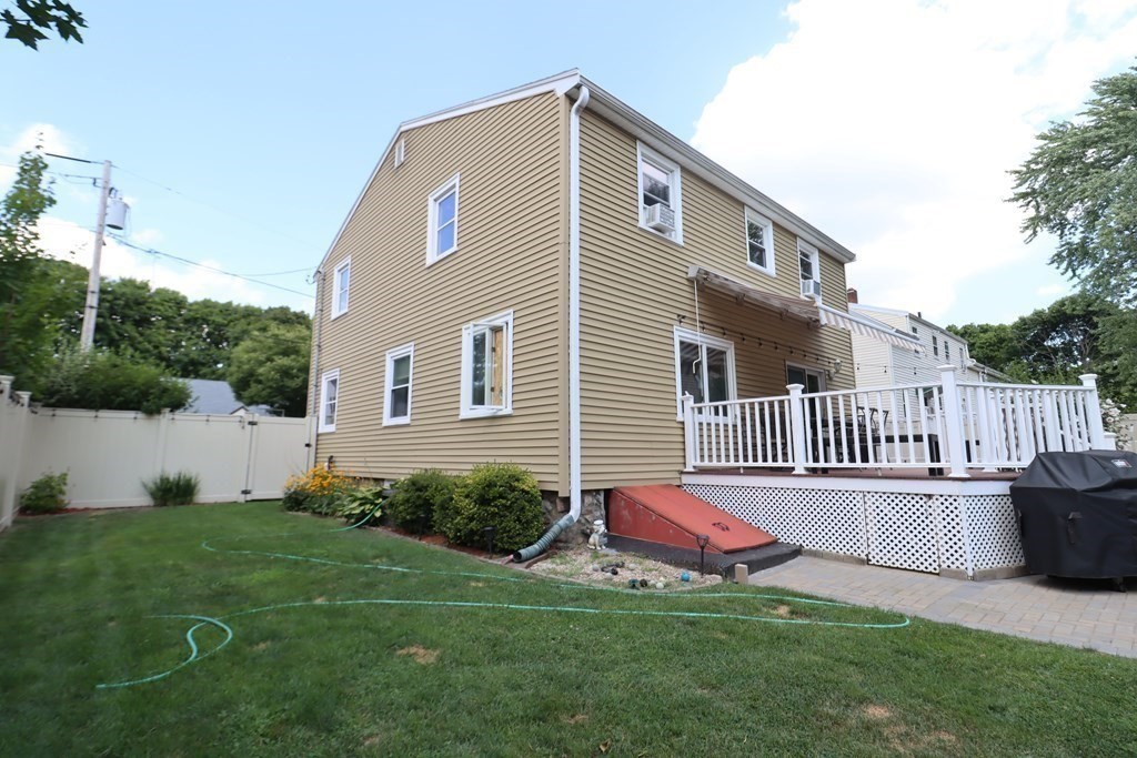 31 Longview Way Peabody, MA 01960 - Photo 34 of 42 a backyard of a house with table and chairs