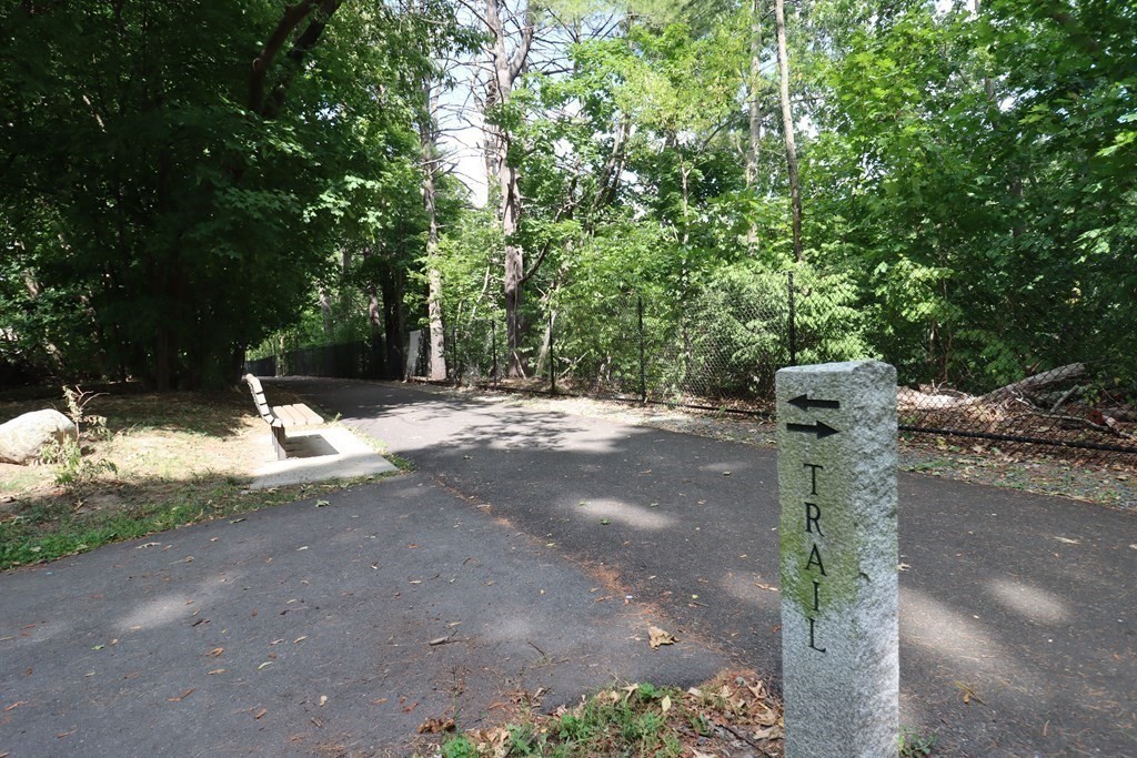 31 Longview Way Peabody, MA 01960 - Photo 39 of 42 a wooden bench with trees in the background