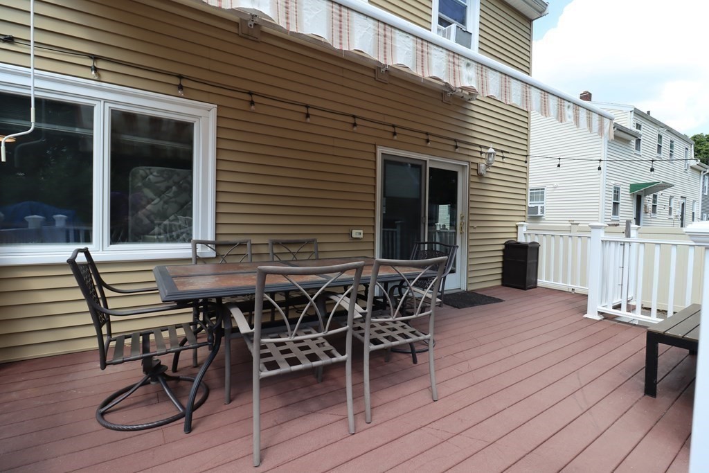 31 Longview Way Peabody, MA 01960 - Photo 6 of 42 a patio with table and chairs and potted plants