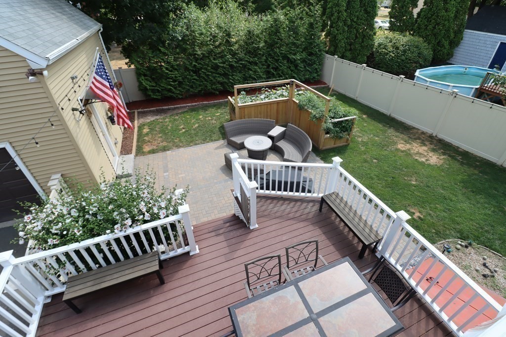 31 Longview Way Peabody, MA 01960 - Photo 8 of 42 a view of a deck with two chairs and a table