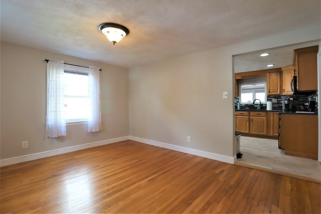 31 Longview Way Peabody, MA 01960 - Photo 9 of 42 a view of a kitchen with wooden floor and a window