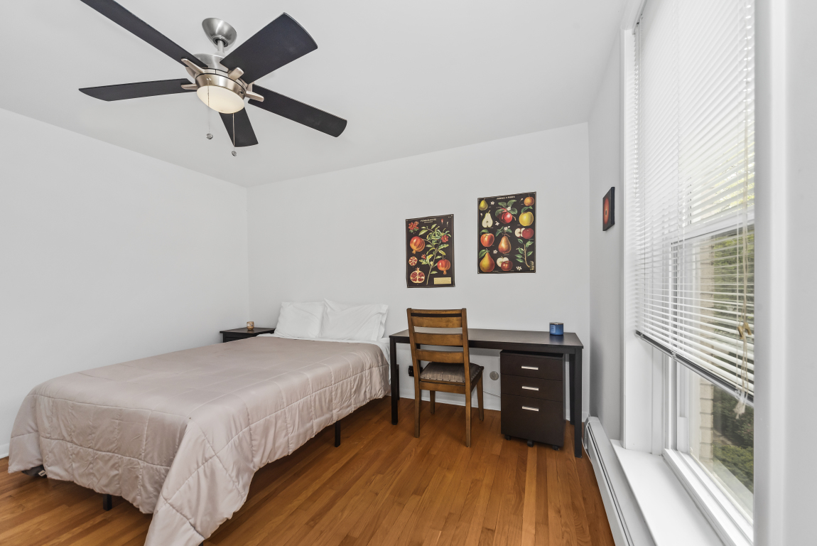 2141 Ridge Avenue, Unit 2B Evanston, IL 60201 - Photo 15 of 17 a bedroom with a bed and a table