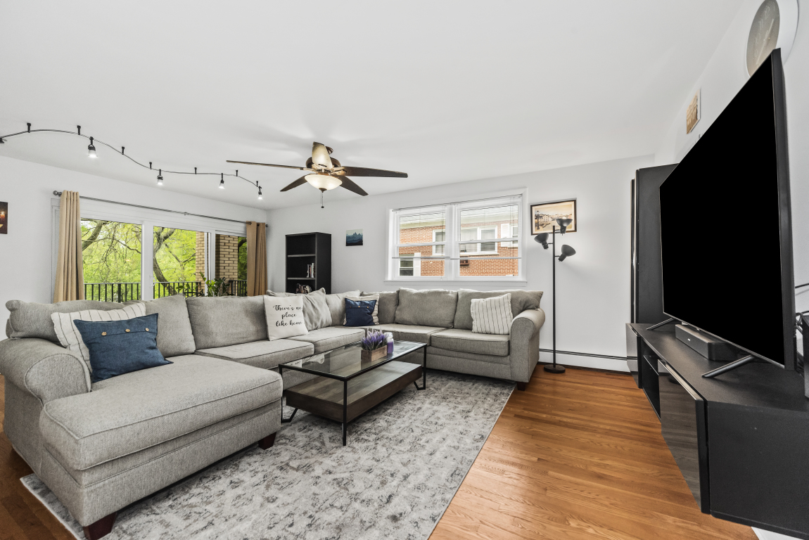 2141 Ridge Avenue, Unit 2B Evanston, IL 60201 - Photo 2 of 17 a living room with furniture and a flat screen tv
