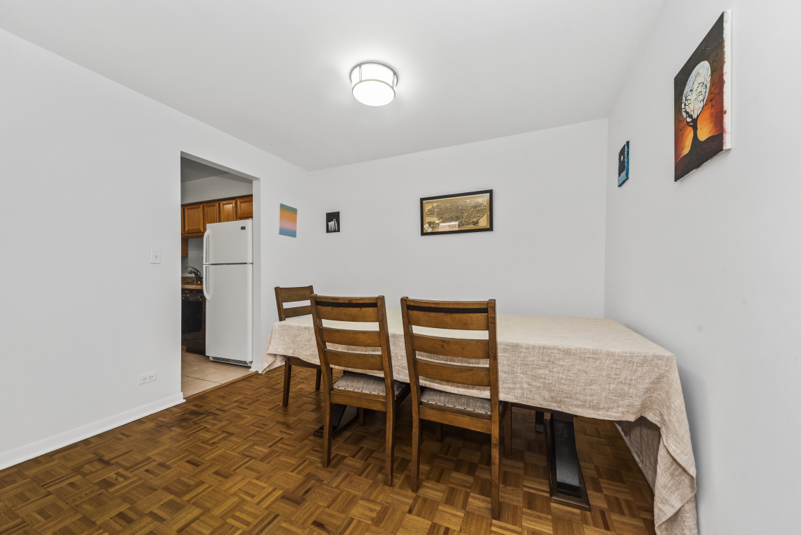 2141 Ridge Avenue, Unit 2B Evanston, IL 60201 - Photo 6 of 17 a view of a livingroom with furniture and a table in it
