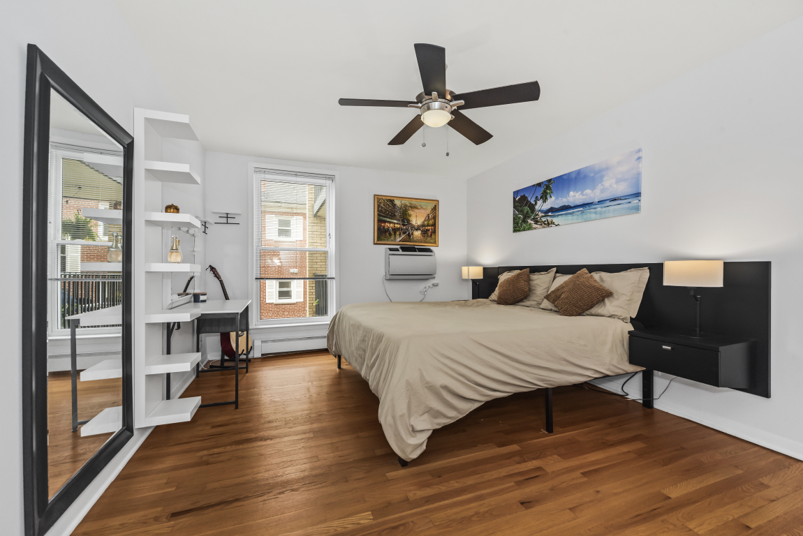 2141 Ridge Avenue, Unit 2B Evanston, IL 60201 - Photo 10 of 17 a spacious bedroom with a bed and wooden floor