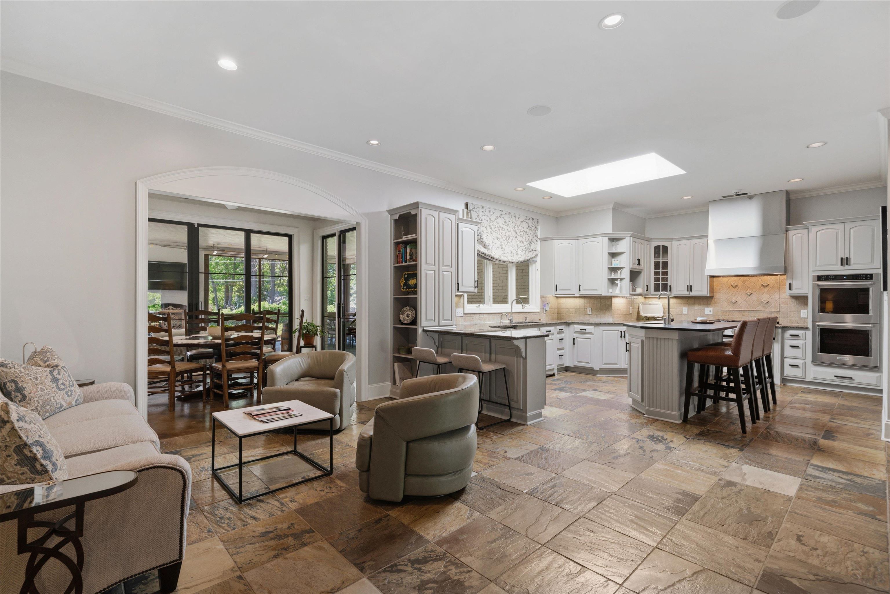 4710 Gwynne Road Memphis, TN 38117 - Photo 12 of 40 a living room with stainless steel appliances kitchen island granite countertop furniture and a kitchen view