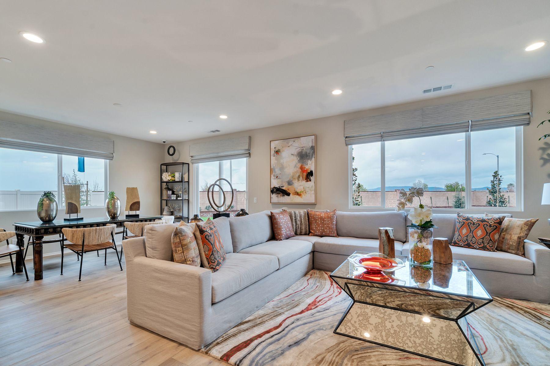 1748 East Holguin Street Lancaster, CA 93535 - Photo 18 of 20 a living room with furniture and a large window