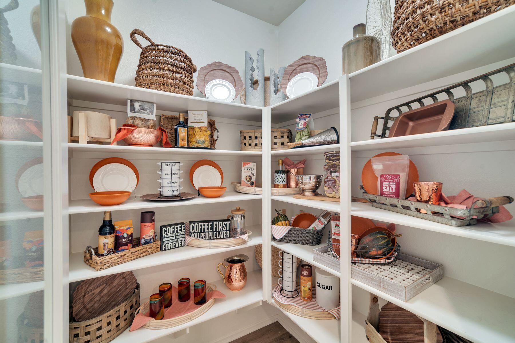 1748 East Holguin Street Lancaster, CA 93535 - Photo 19 of 20 a kitchen with lots of clutter and cabinets