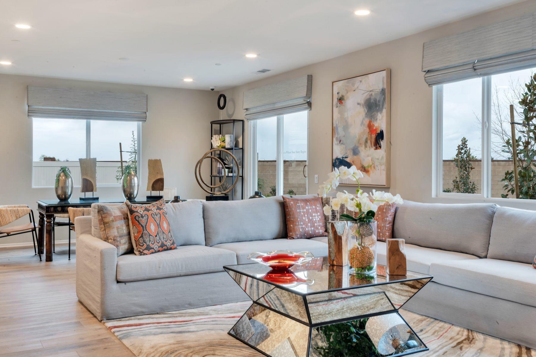 1748 East Holguin Street Lancaster, CA 93535 - Photo 20 of 20 a living room with furniture and a large window