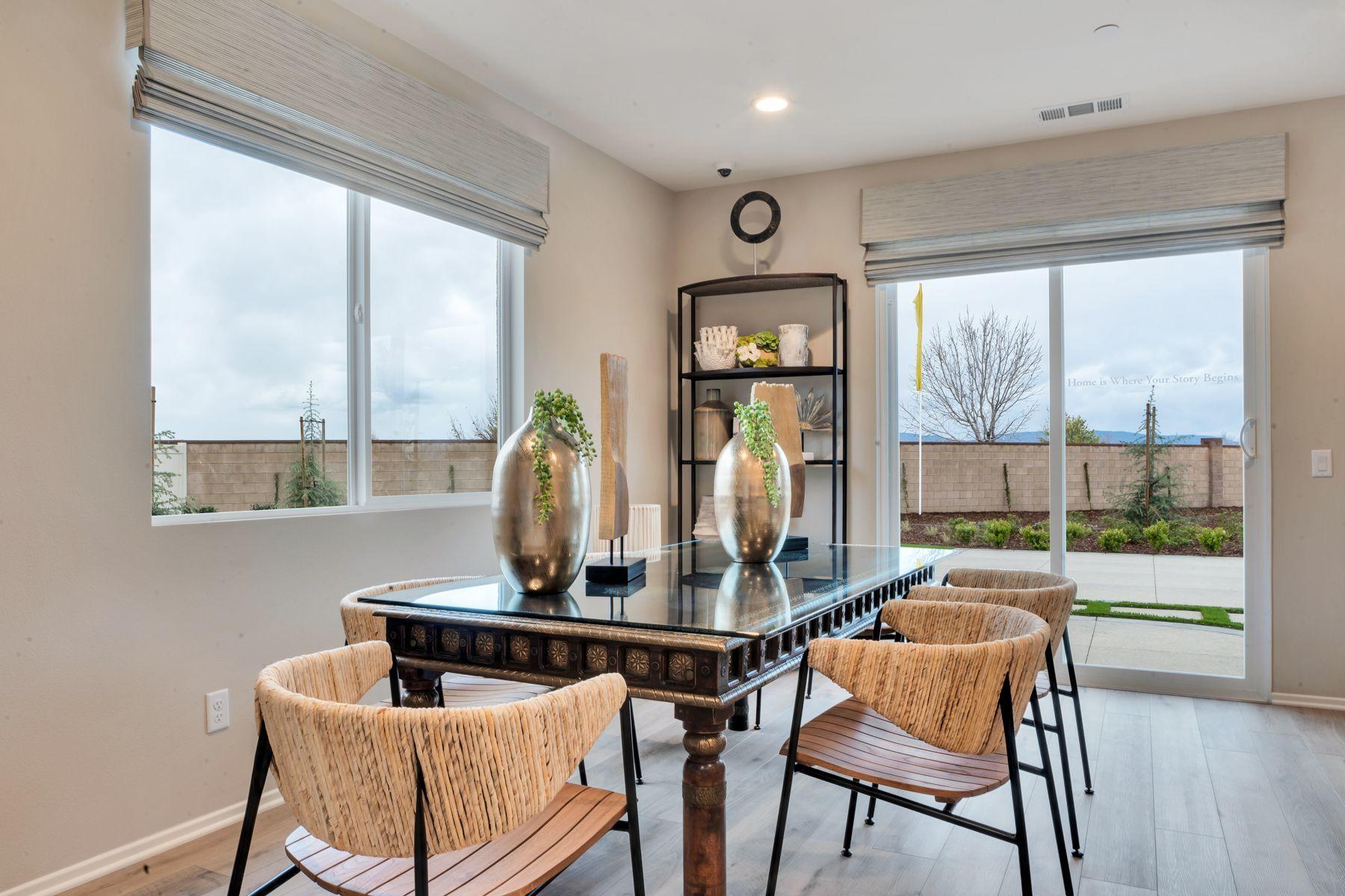 1748 East Holguin Street Lancaster, CA 93535 - Photo 6 of 20 a dining room with furniture and a window