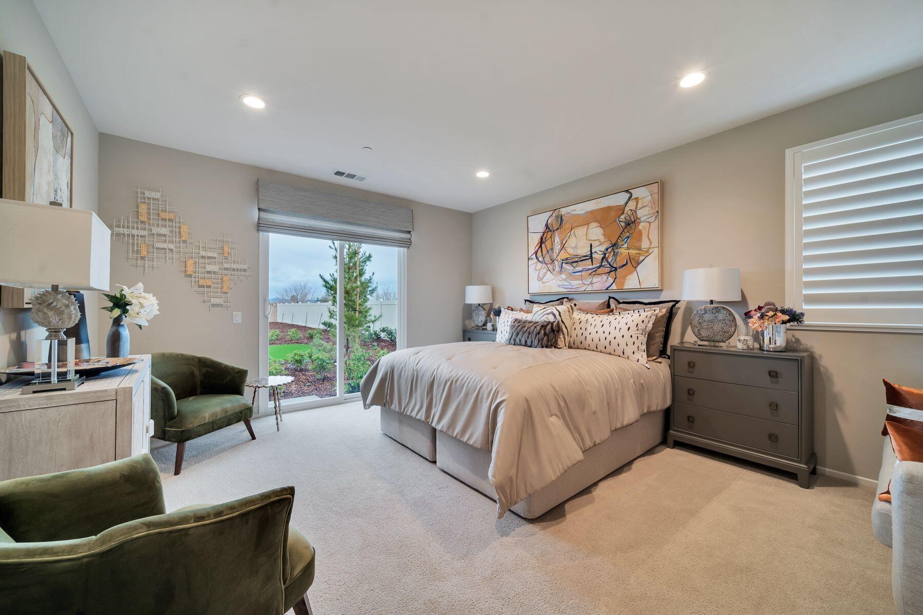 1748 East Holguin Street Lancaster, CA 93535 - Photo 7 of 20 a bedroom with a bed and a couch