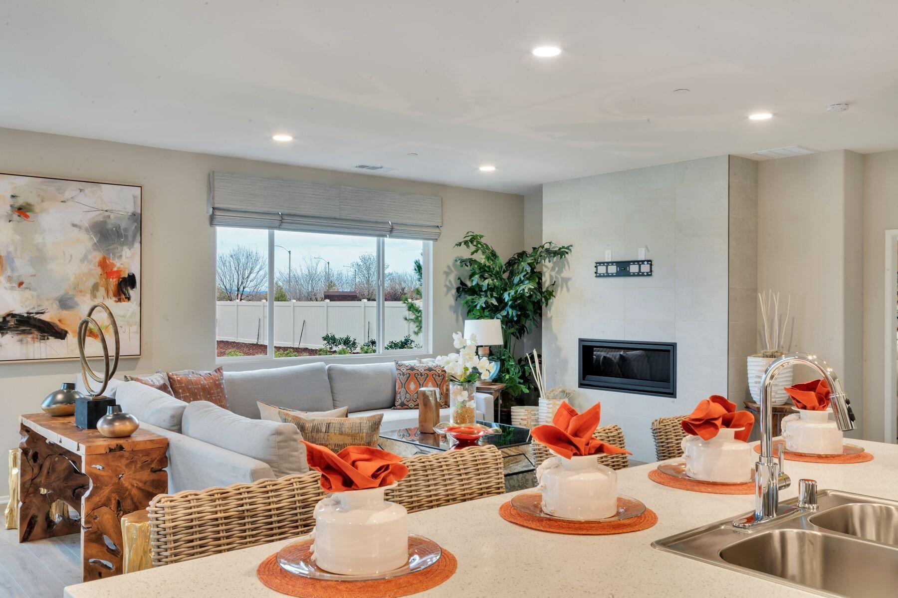 1748 East Holguin Street Lancaster, CA 93535 - Photo 9 of 20 a living room with furniture and a fireplace