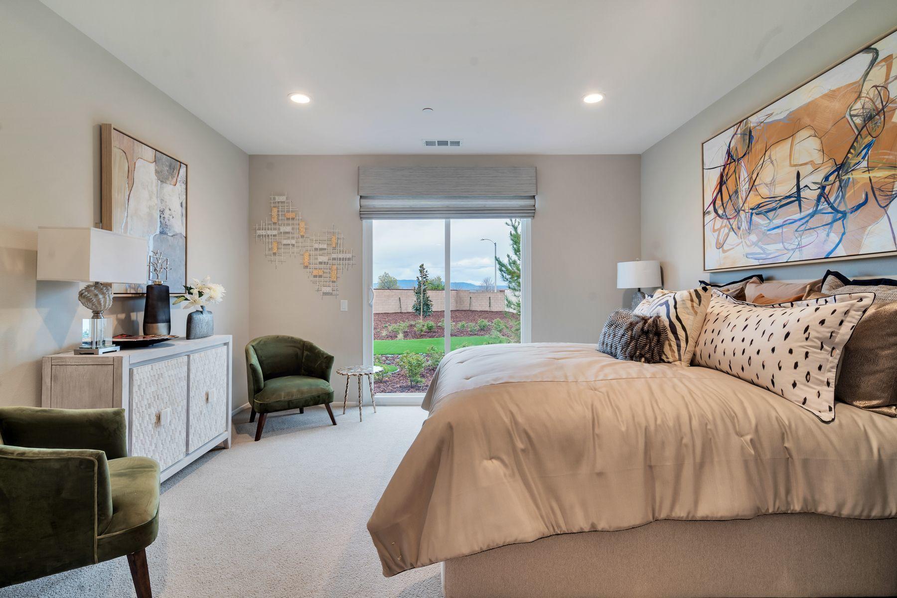 1748 East Holguin Street Lancaster, CA 93535 - Photo 10 of 20 a living room with furniture and a large window