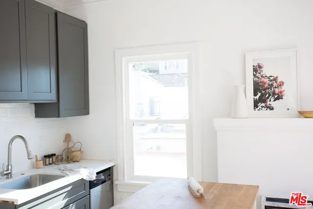 a kitchen with a sink and a window