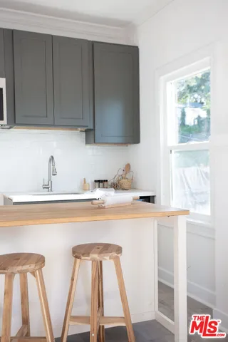 a bedroom with furniture and a potted plant