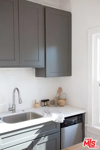 a bedroom with a bed and a wall painting