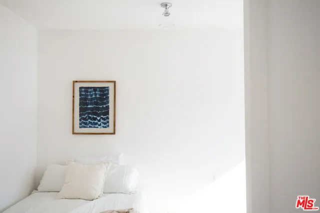 a bathroom with a toilet sink and a mirror