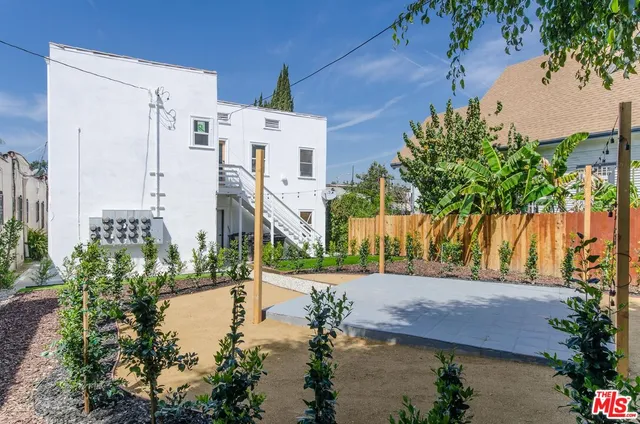 a view of a hallway with entryway wooden floor and front door