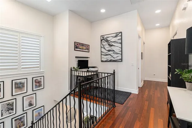 a view of a hallway with furniture and front door
