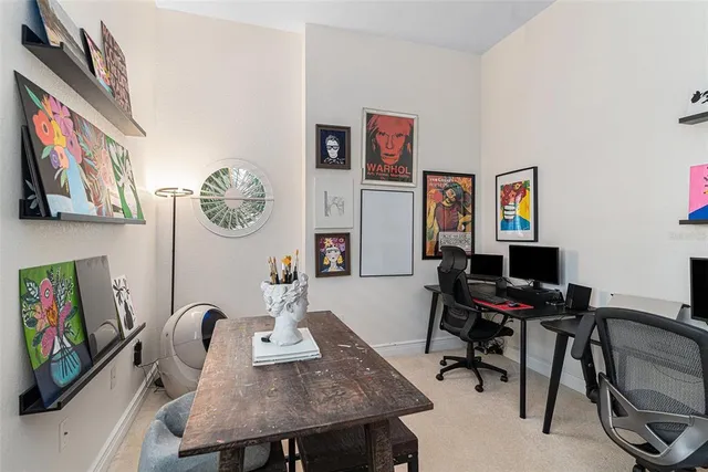 a view of a workspace with furniture and toys