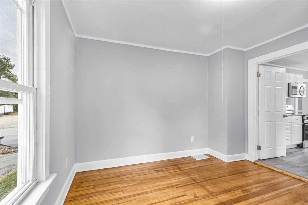 125 Verge Street Springfield, MA 01129 - Photo 17 of 42 a view of a room with wooden floor and bedroom
