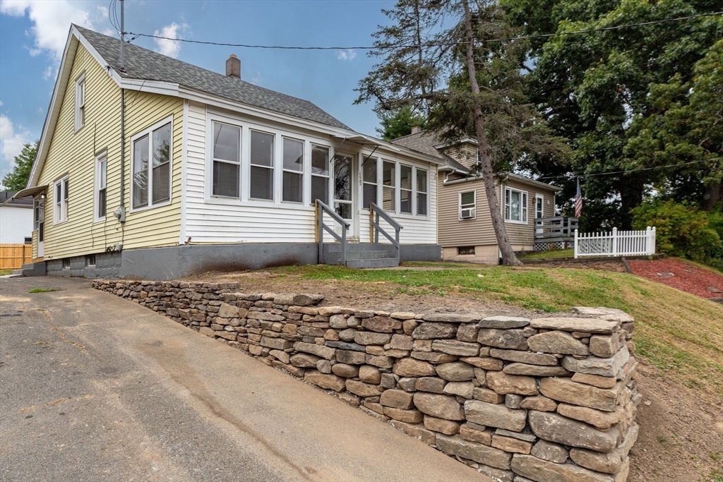 125 Verge Street Springfield, MA 01129 - Photo 2 of 42 a front view of a house with a yard