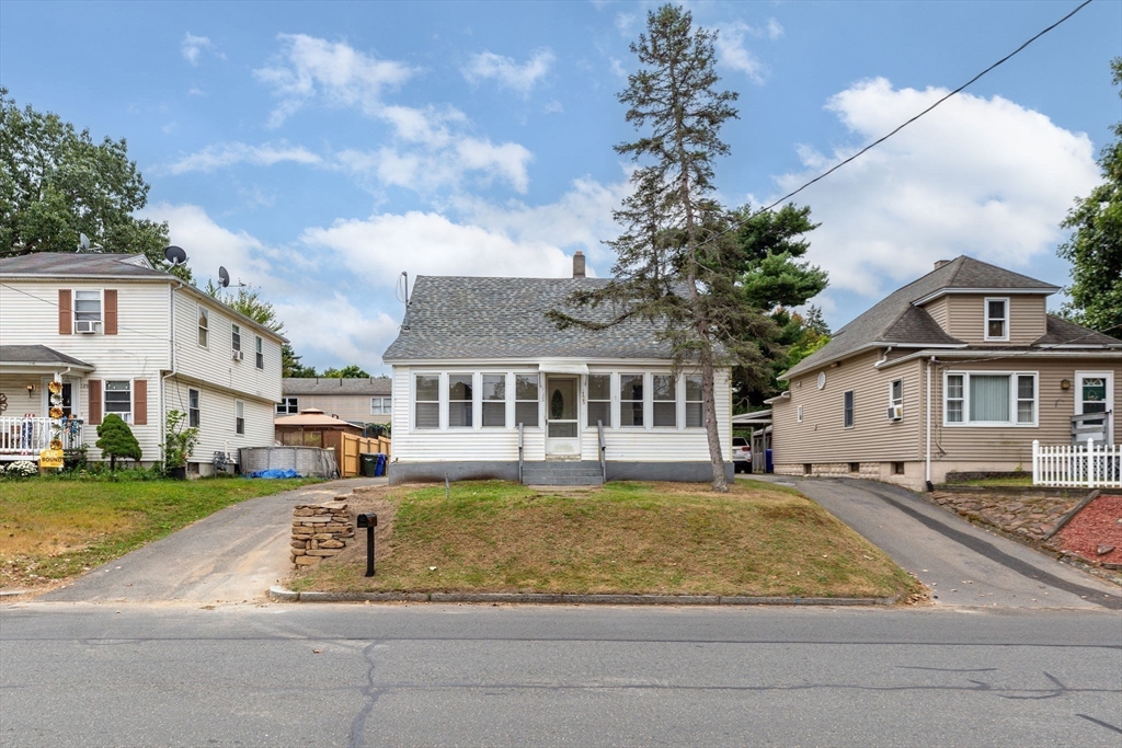 125 Verge Street Springfield, MA 01129 - Photo 3 of 42 a front view of a house with a yard table and chairs