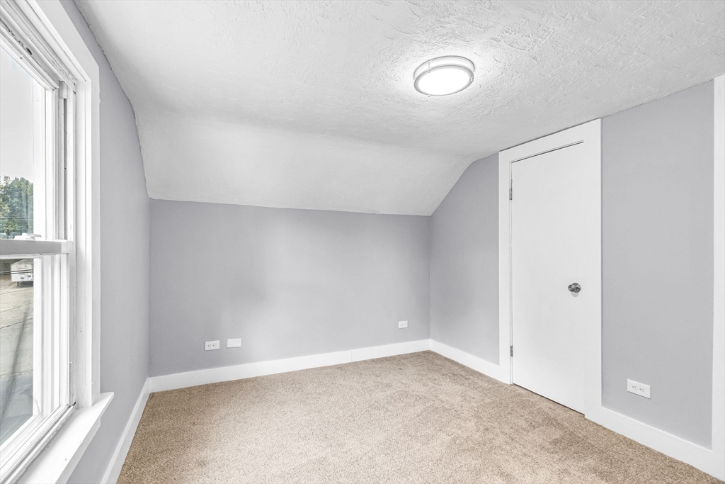 125 Verge Street Springfield, MA 01129 - Photo 33 of 42 an empty room with a empty space and windows