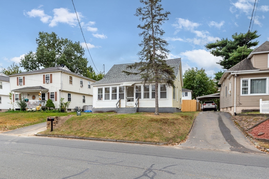 125 Verge Street Springfield, MA 01129 - Photo 4 of 42 a white house that has a tree in front of it
