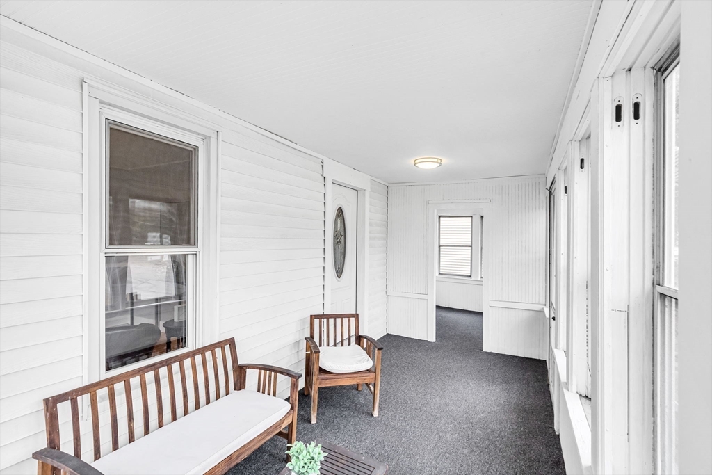 125 Verge Street Springfield, MA 01129 - Photo 5 of 42 a view of a hallway with bathroom and wooden floor