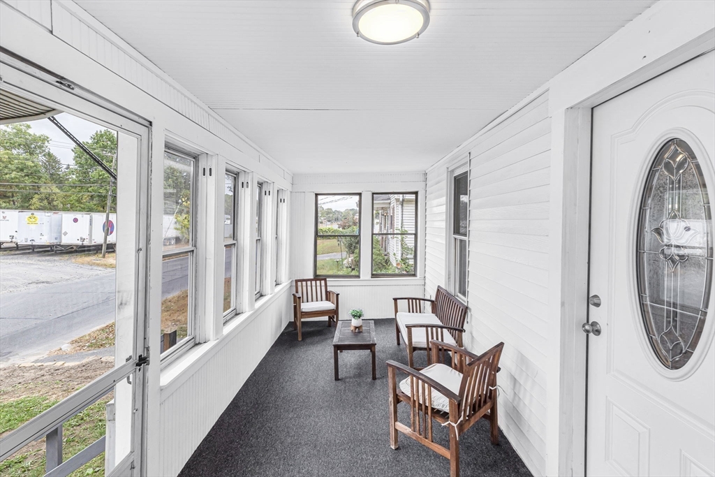 125 Verge Street Springfield, MA 01129 - Photo 6 of 42 a living room with furniture and a floor to ceiling window