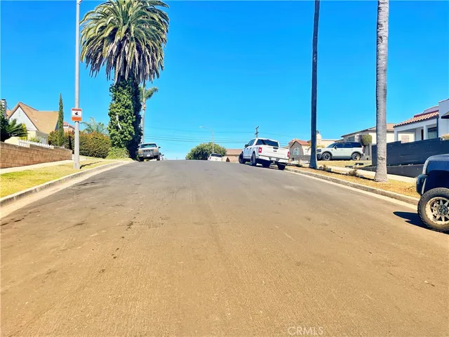 a view of a street with cars