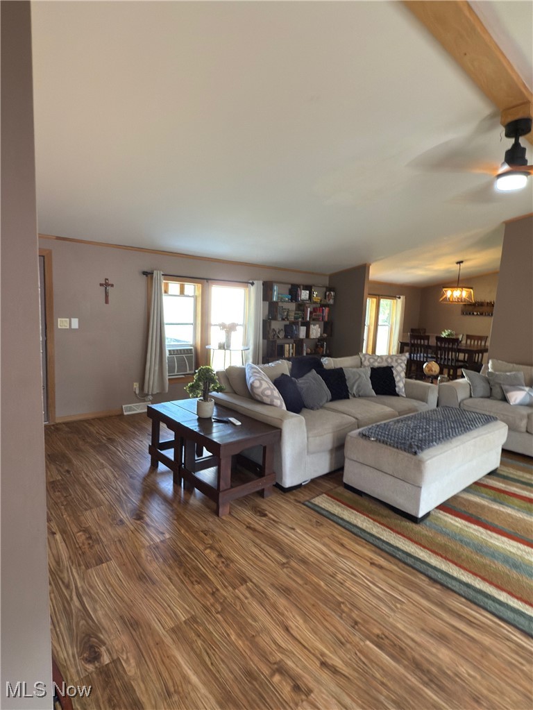 3868 Cook Road Rootstown, OH 44272 - Photo 8 of 44 Family Room featuring wood finished floors, ceiling fan and a/c window unit