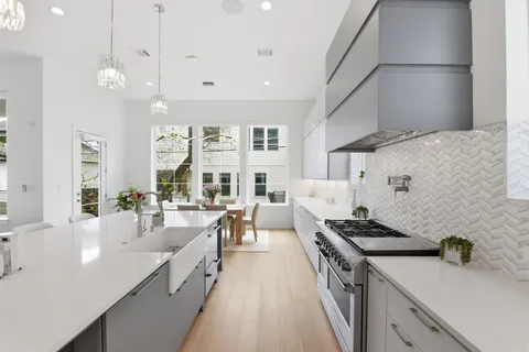 a view of a kitchen with fridge and rack