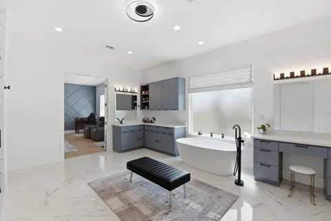 a large kitchen with lots of counter space and windows