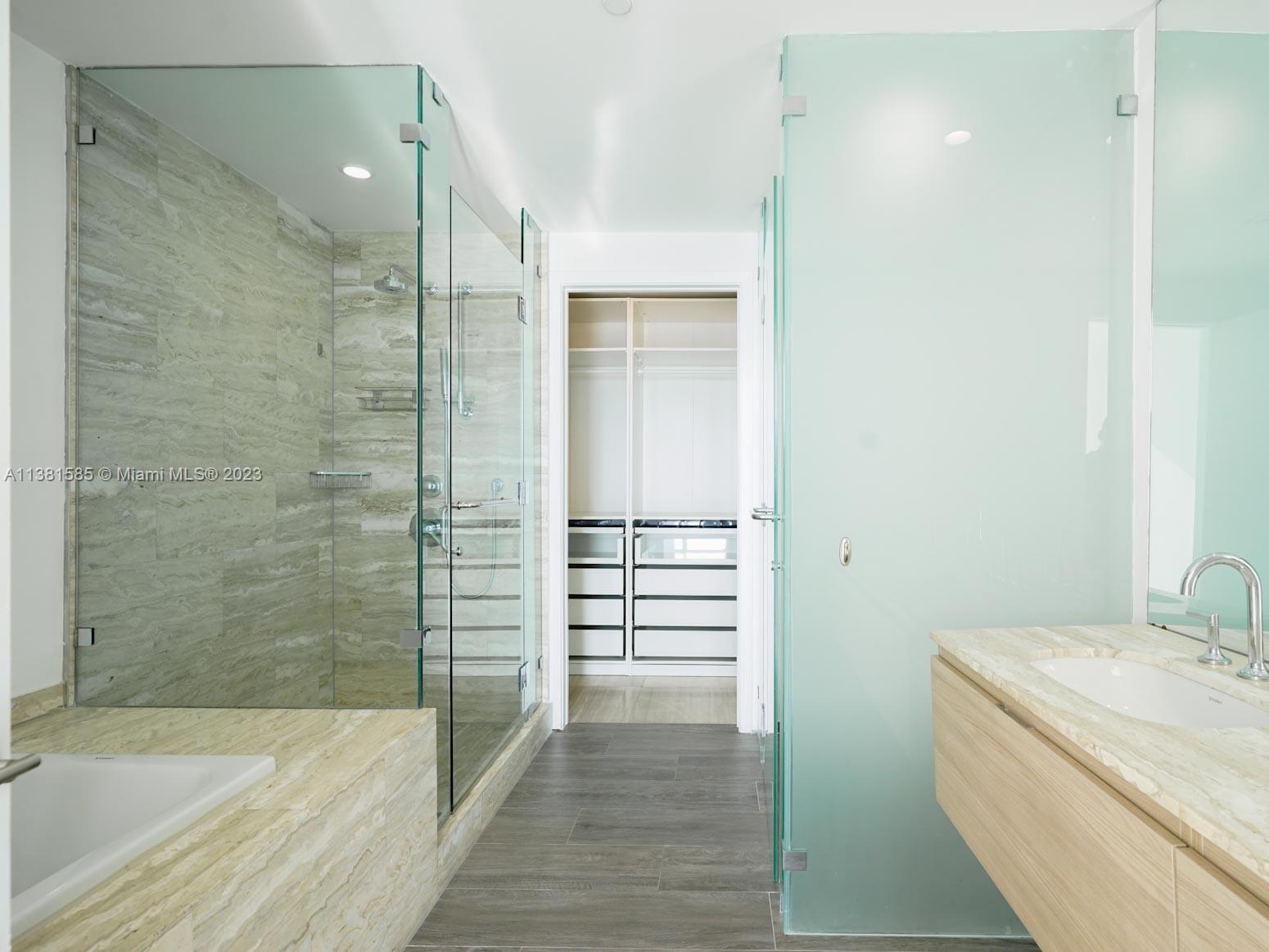 Edgewater Miami, FL 33137 - Photo 11 of 42 a bathroom with a sink and a shower