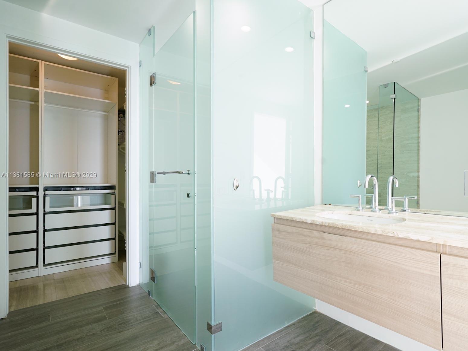 Edgewater Miami, FL 33137 - Photo 13 of 42 a bathroom with a sink and a mirror