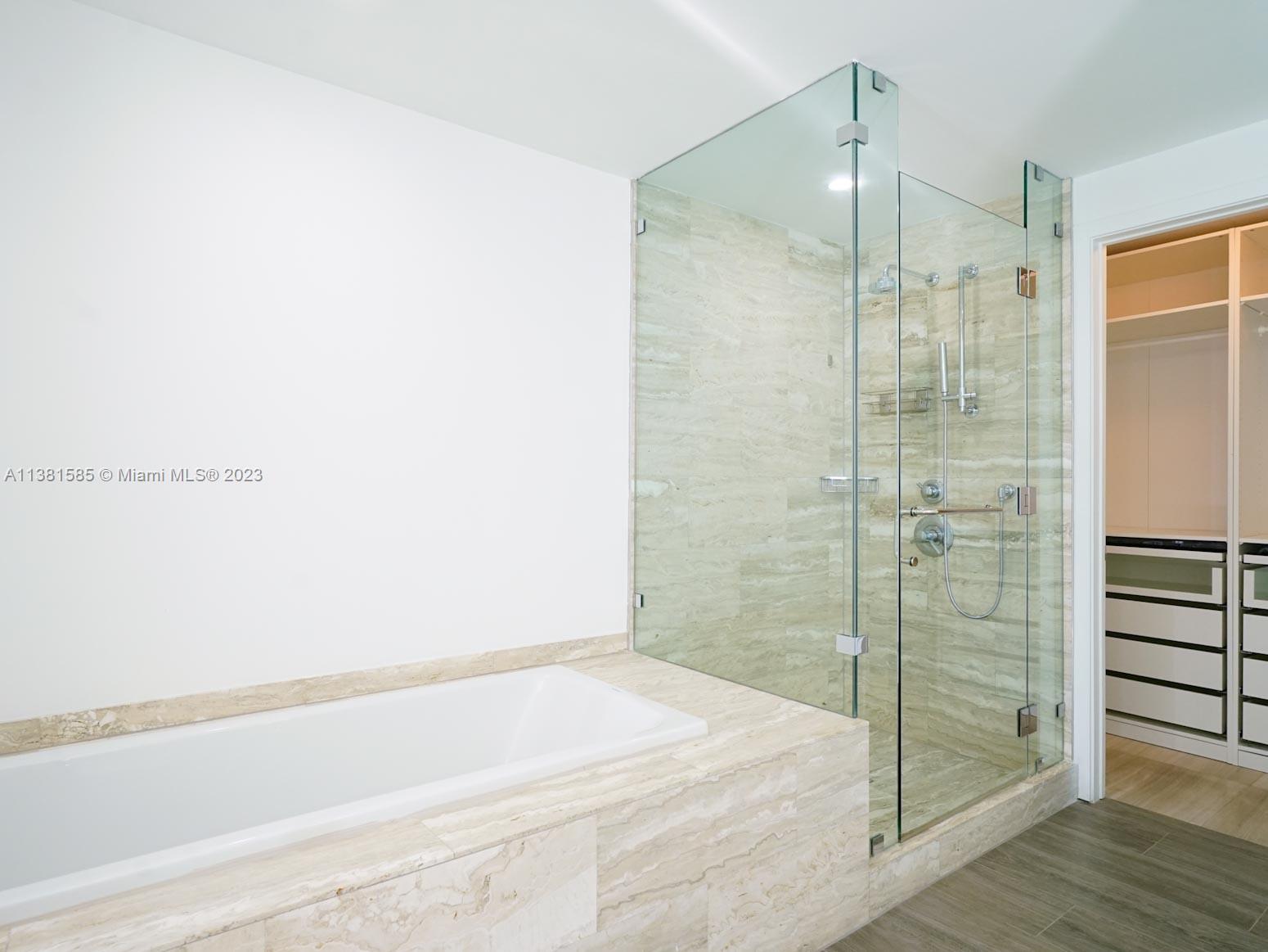 Edgewater Miami, FL 33137 - Photo 16 of 42 a bathroom with a bathtub and a shower