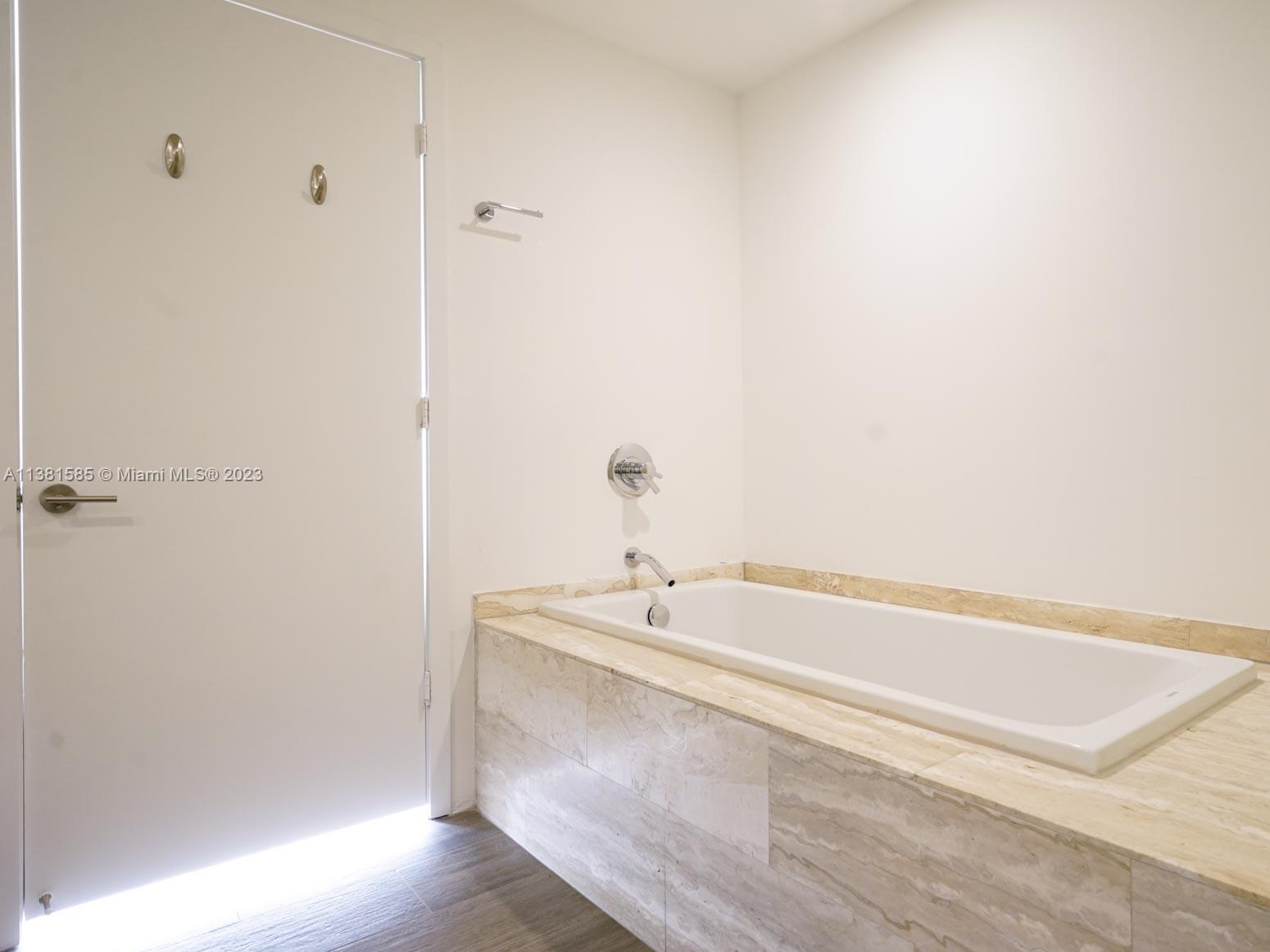 Edgewater Miami, FL 33137 - Photo 18 of 42 a bathroom with a bathtub