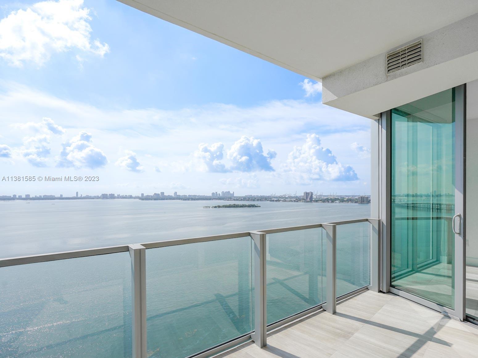 Edgewater Miami, FL 33137 - Photo 2 of 42 a bathroom with a granite countertop sink and a mirror