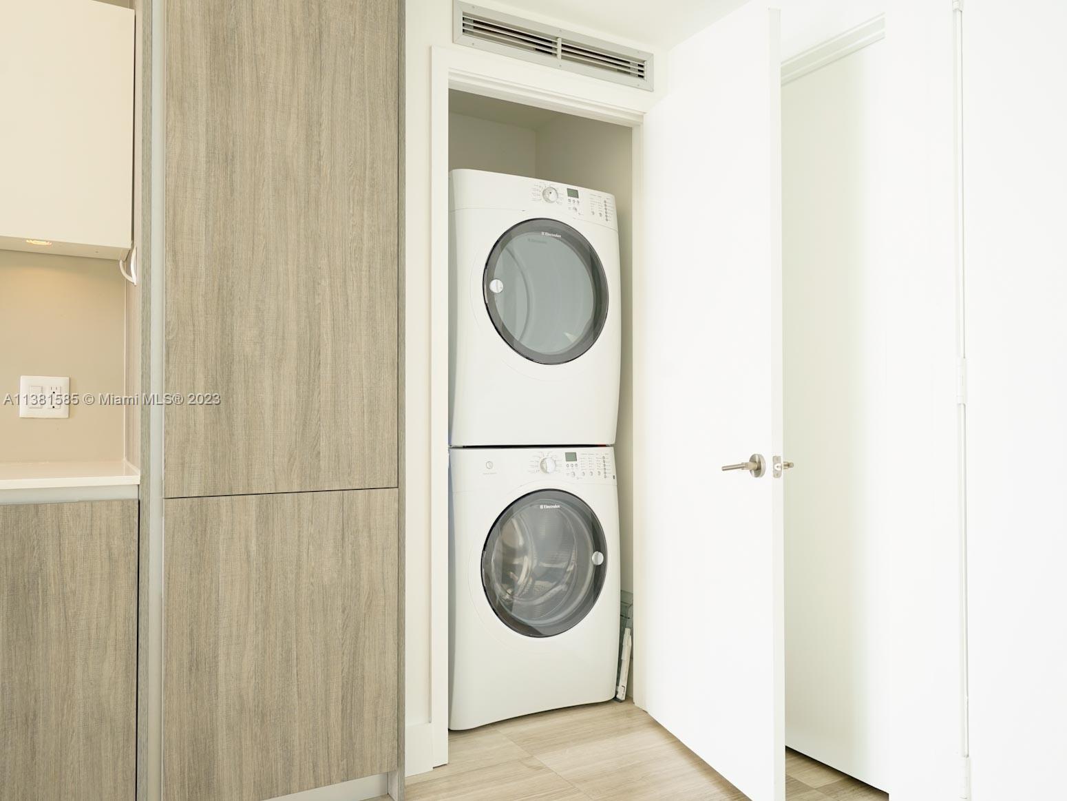 Edgewater Miami, FL 33137 - Photo 24 of 42 a view of a bathroom with washing machine and a washer