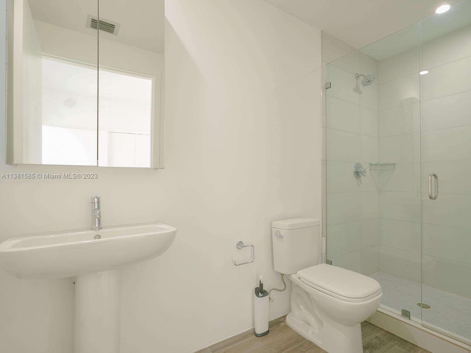 Edgewater Miami, FL 33137 - Photo 30 of 42 a bathroom with a sink toilet and shower