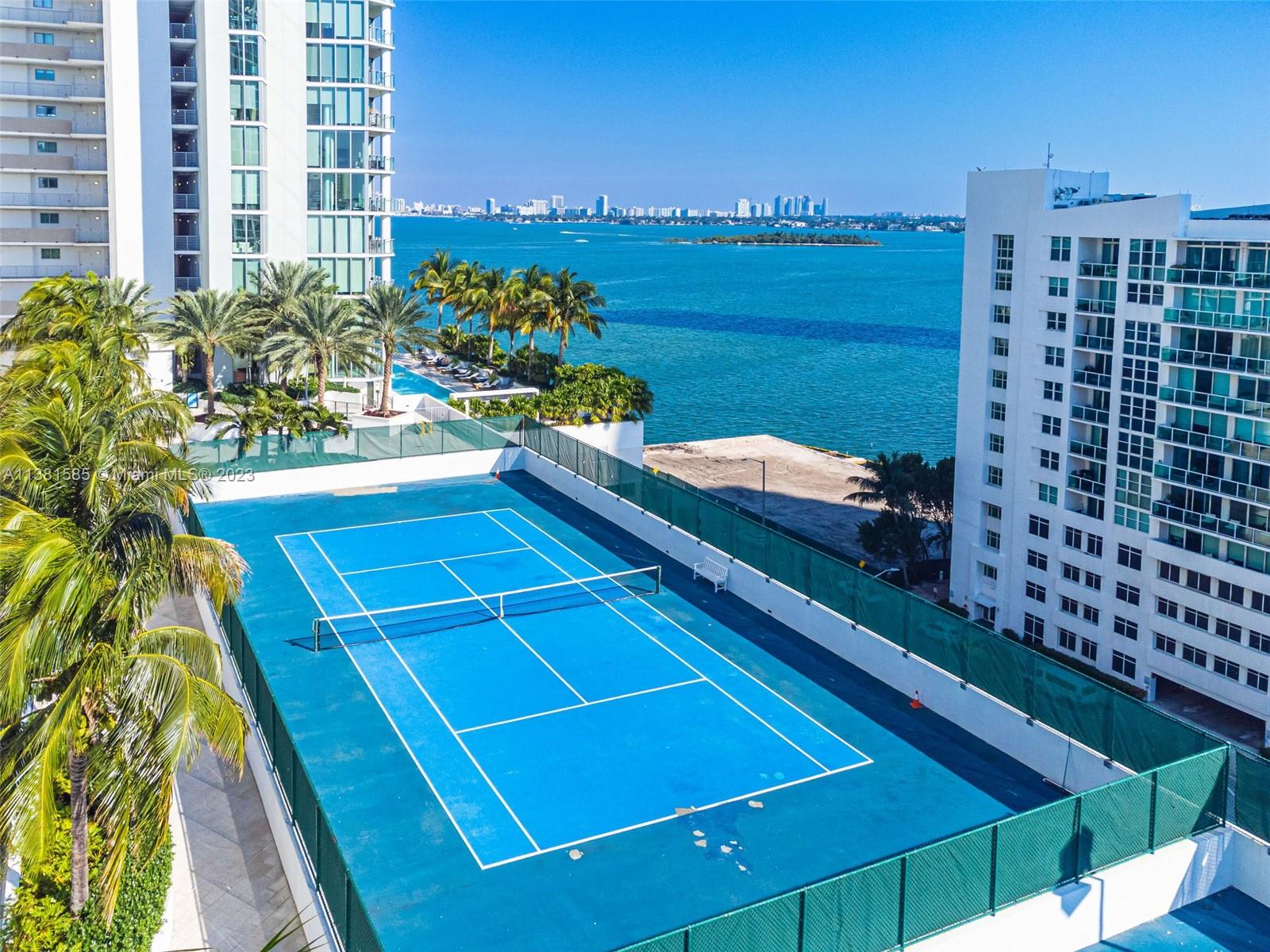 Edgewater Miami, FL 33137 - Photo 37 of 42 a view of balcony with two chairs and a potted plant